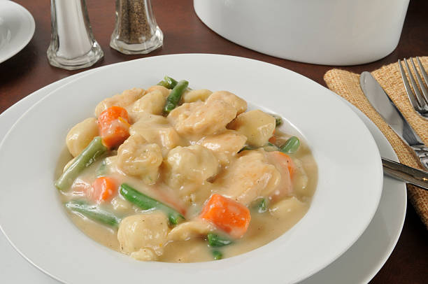 Bowl of chicken and dumplings Closeup of a bowl of chicken and dumplings dumpling stock pictures, royalty-free photos & images