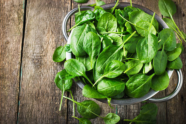 istock Fresh spinach in metal colander 478177088