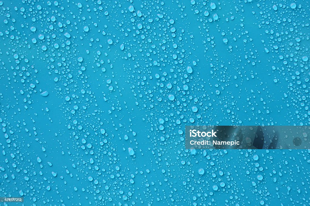 Water drop texture on blue background. Close up water drop texture on blue background. Water Stock Photo