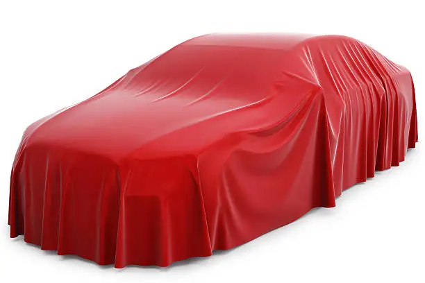 Presentation of the new car. Car covered with a red cloth.