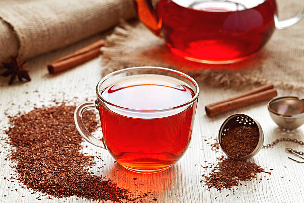 Healthy traditional herbal rooibos beverage tea with spices on vintage stock photo