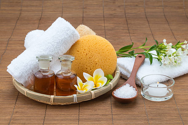 istock spa bath, salt spoon, candle towel sponge essential oil flower 478184268