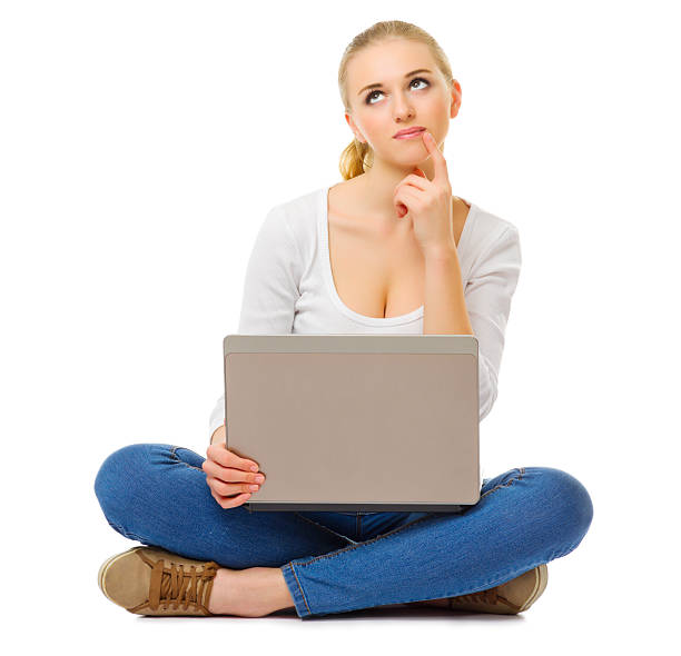 istock Young thinking woman with laptop 478189879