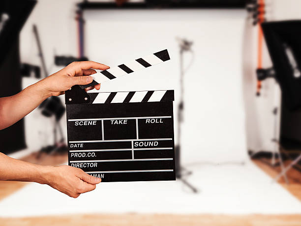 istock Man with film clapper in studio 478190928