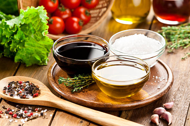 Vinaigrette ingredients on rustic wood table