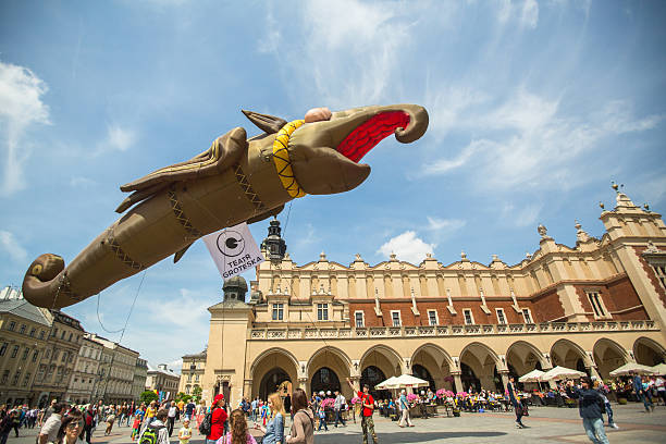 Krakow, Poland - May 31, 2015: During the parade of dragons on Main Square near St.Mary's Basilica. Great dragons parade is an annual event dedicated to the symbol of the city, was first held in 2000.