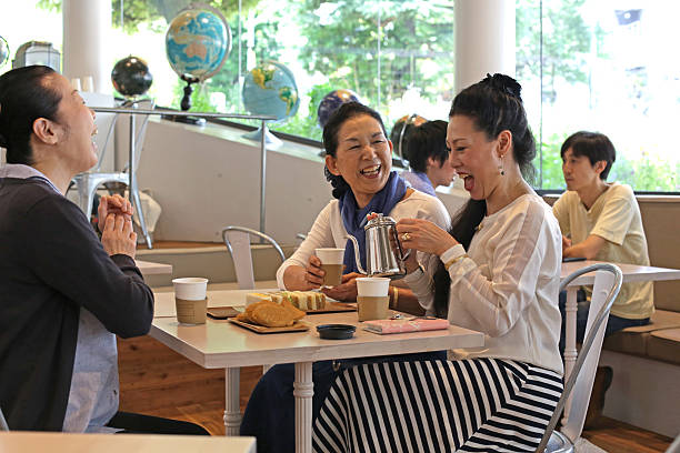istock Three Japanese Seniors Laughing in a Tokyo Cafe 478192302