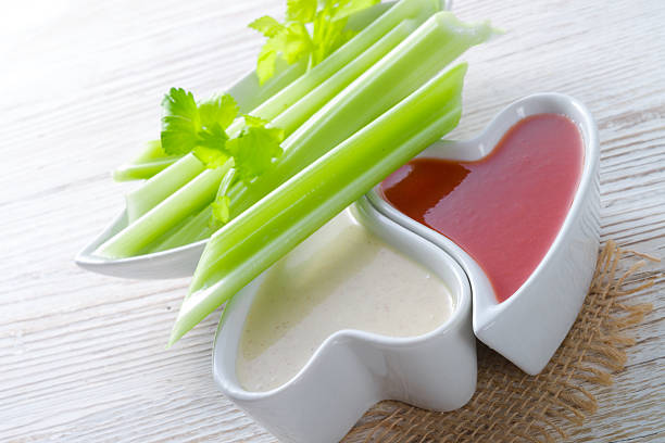 celery dippen celery dippencelery dippencelery dippen celery heart stock pictures, royalty-free photos & images