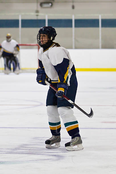istock Female ice hockey player skating during the game 478196695