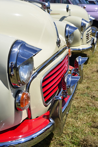 Jersey, U.K. - June 6, 2015: A collection of Morris Minors from the 40's and 50's parked on show at West Park for the Jersey car festival.