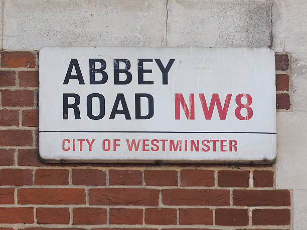 Abbey Road sign in London London, UK - June 10, 2015: Abbey Road sign made famous by the 1969 Beatles album cover album title stock pictures, royalty-free photos & images