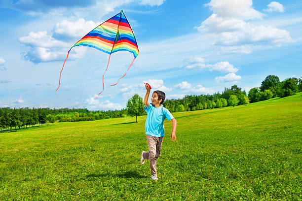 happy boy run with kite - flying kite bildbanksfoton och bilder