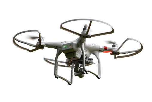 Waunakee, WI, USA - June 20, 2015: Small, remotely controlled drone with camera hovers in the sky. Privacy and safety concerns are becoming a hot topic for these devices as drones becore cheaper and more widely available.