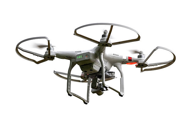 Isolated Flying Phantom Drone Waunakee, WI, USA - June 20, 2015: Small, remotely controlled drone with camera hovers in the sky. Privacy and safety concerns are becoming a hot topic for these devices as drones becore cheaper and more widely available. unmanned aerial vehicle stock pictures, royalty-free photos & images