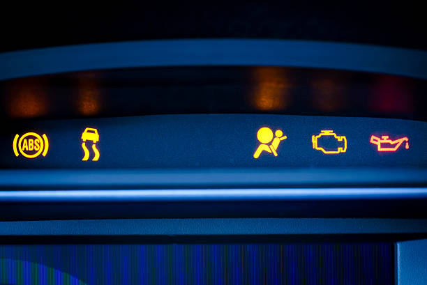 Photo of vehicle interior presenting Instrument cluster with visible illuminated red and yellow indicators of ABS warning lamp, Stability Control(ESP) indicator, Passenger Airbag Indication, Malfunction Indicator  lamp, Oil pressure warning lamp.