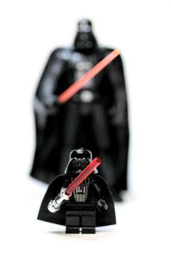 Vancouver, Canada - December 18, 2012: A lego Darth Vader and one from the Hasbro toy collection, from the Star Wars film franchise, against a white background.