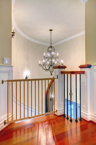 istock Luxury curved staircase with chandelier and harwood. 478202433