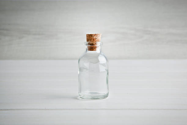 Empty bottle wood background stock photo