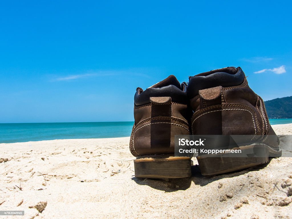 Leather shoes sneaker on beach in Thailand Leather shoes sneaker on beach in Thailand Welcome to summer Season in thailand ,Concept Vacation,Holiday,Tourism,Relax,Travel 2015 Stock Photo