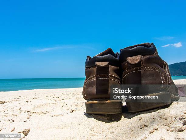 Leather Shoes Sneaker On Beach In Thailand Stock Photo - Download Image Now - 2015, Backgrounds, Beach