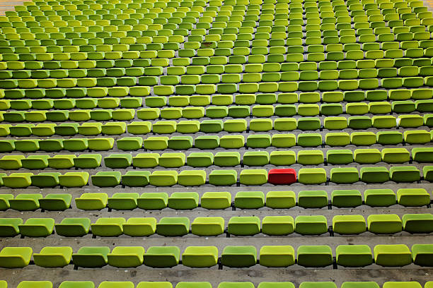 Green and Red Empty Seats stock photo