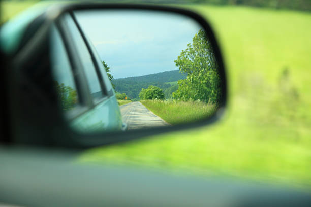 istock road car rear view mirror motion blur background 478209339
