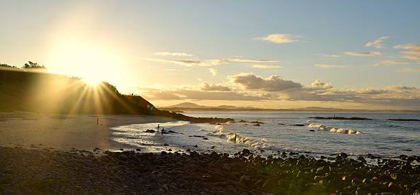 istock Sunset at beach with surfers and fishermand 478211338