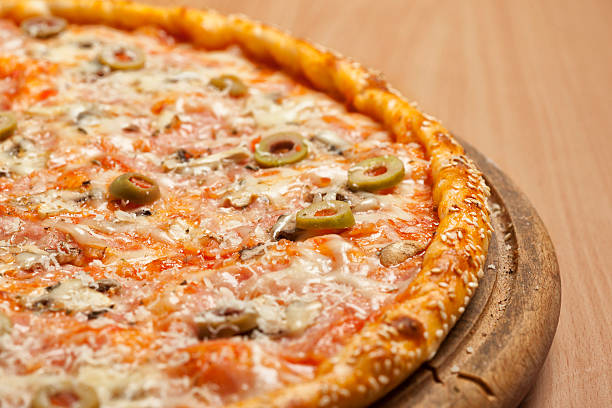 istock Tasty pizza on wooden board 478211454