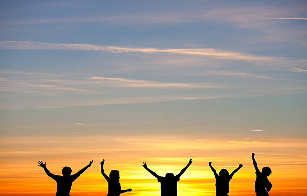 istock silhouetted kids in sunset 478211763