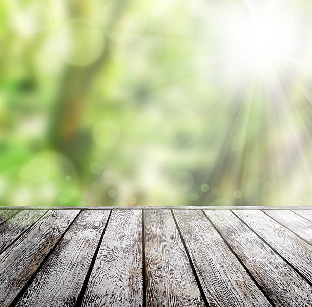 istock wood floor with green bokeh . 478211951