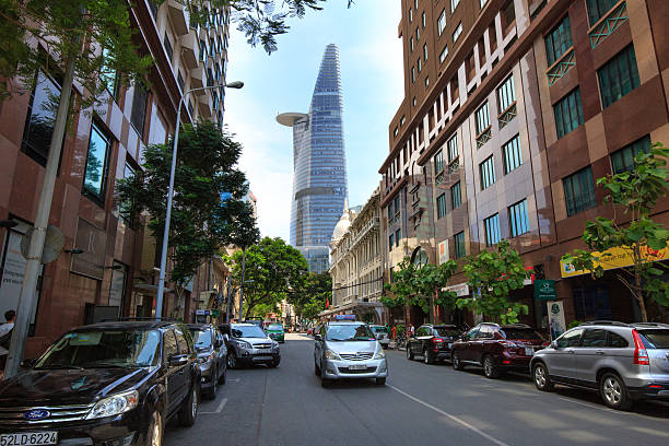 Hochiminh City, Vietnam June - 6 2015 : a street in downtown HCM overlooking the Bitexco tower, Financial Tower stands at an altitude of 262.5 meters it is the second tallest building in the world 124