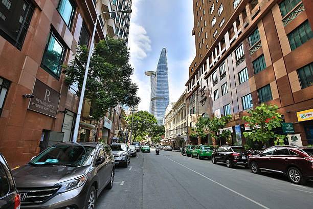 Hochiminh City, Vietnam June - 6 2015 : a street in downtown HCM overlooking the Bitexco tower, Financial Tower stands at an altitude of 262.5 meters it is the second tallest building in the world 124