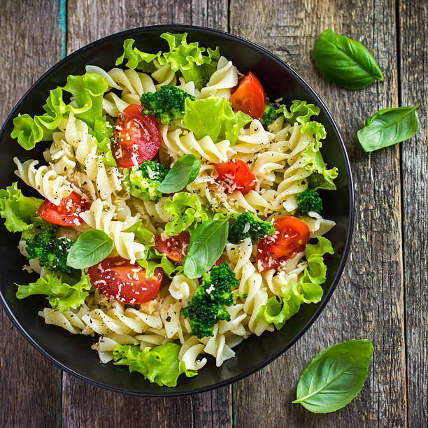 istock Pasta salad with cherry tomatoes and broccoli 478212680