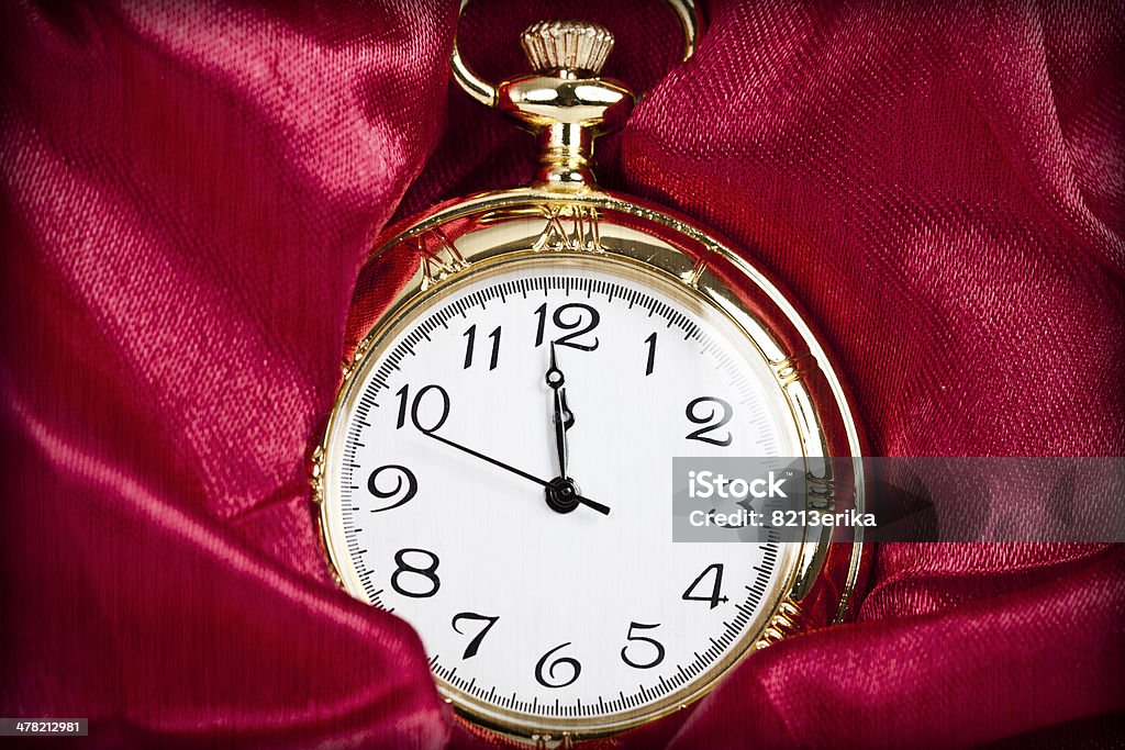 Gold pocket watch Old styled gold pocket watch on scarlet silk Abstract Stock Photo