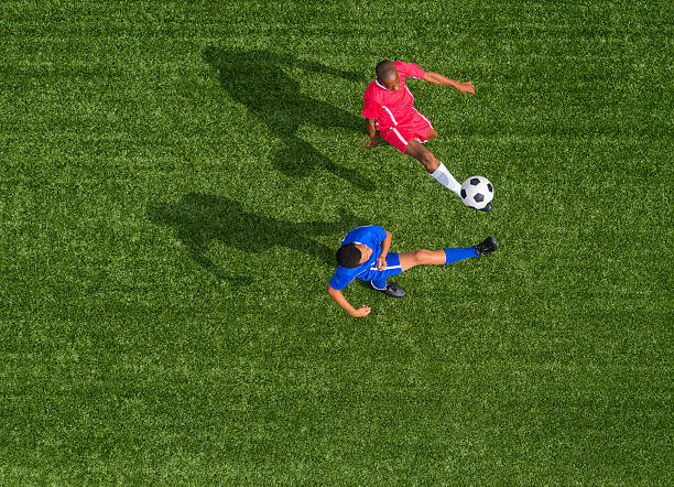 istock Two Young Boys Playing Football 478214663