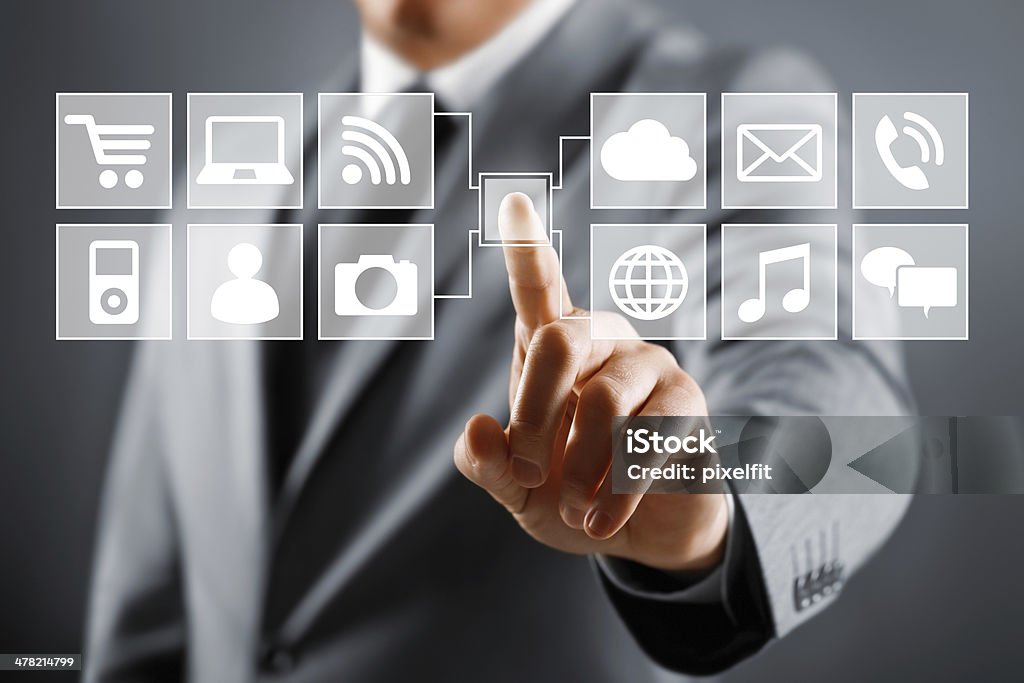 Touch screen concept Businessman touching vusial screen. Adult Stock Photo