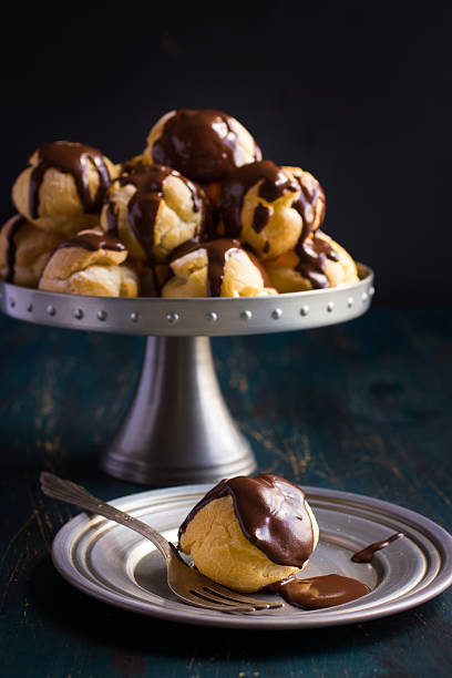 istock profiteroles with cream and chocolate sauce 478215100