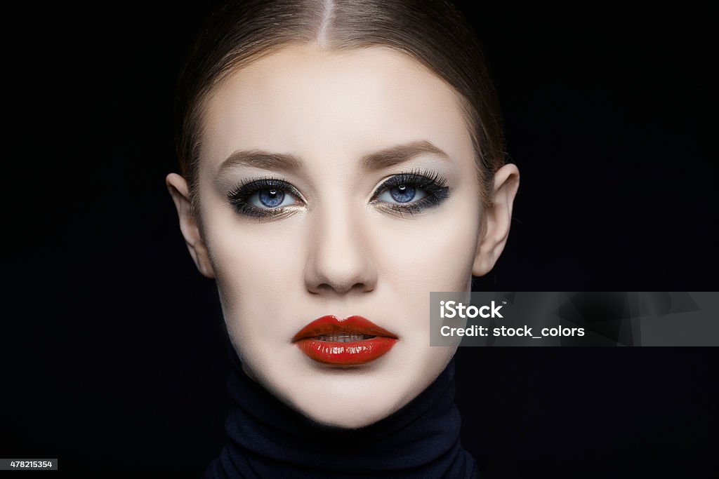 attitude of elegance and charm charming woman portrait with seductive expression looking intense at camera, photo taken on black background in studio shot, professional makeup. 20-24 Years Stock Photo