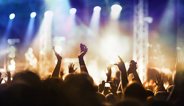 istock People at concert party. 478216382