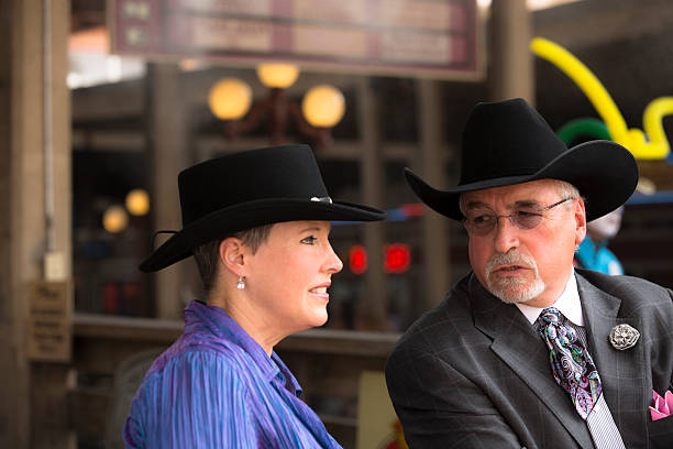 istock Cowboys:  Senior adults talk before the rodeo. Ft. Worth, Texas. 478218289