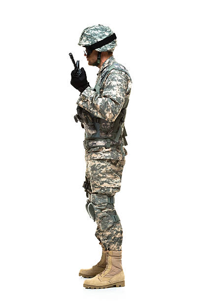 istock Side view of army man standing with rifle 478219141