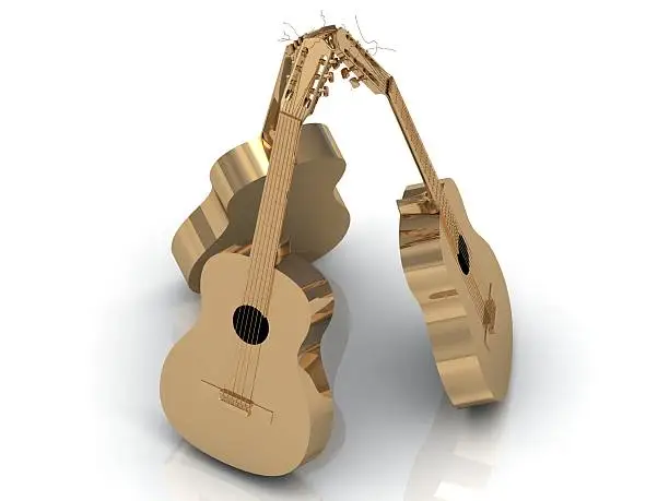 Photo of Three acoustic guitars made of gold