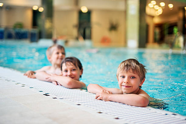 istock Kids in indoors swimming pool 478219774