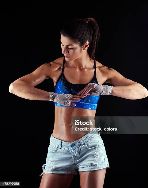 Athletic Woman With Muscular Build Stock Photo - Download Image Now - 20-24 Years, 2015, Abdominal Muscle