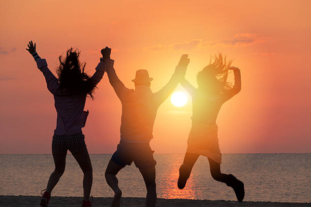 istock Group of People Celebrating on the beach 478223366