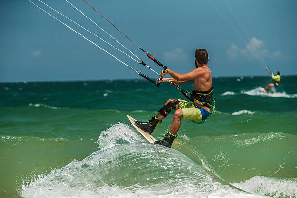 istock Man Kitesurfing in blue sea 478223802