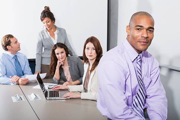 istock Multi-ethnic business people in board room 478224501