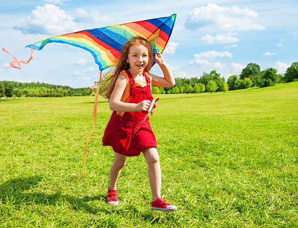 istock Happy girl with kite 478225713