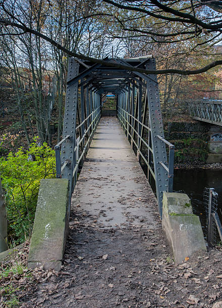 istock steel footbridge over a river 478225999
