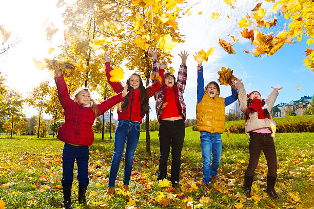 istock Kids enjoying autumn maple park 478226615